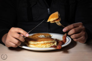 Stock Photography, first bite of pancake, breakfast, pancakes and bacon, restaurant food, man eating breakfast, man eating pancakes