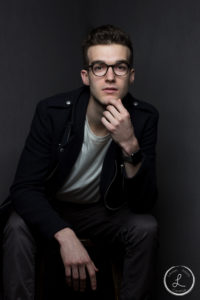 Mens fashion portrait, mens portrait, thinking man, model with glasses, navy coat